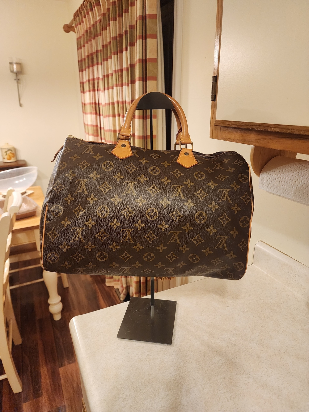 Louis Vuitton Monogram Speedy 35 featuring iconic brown canvas